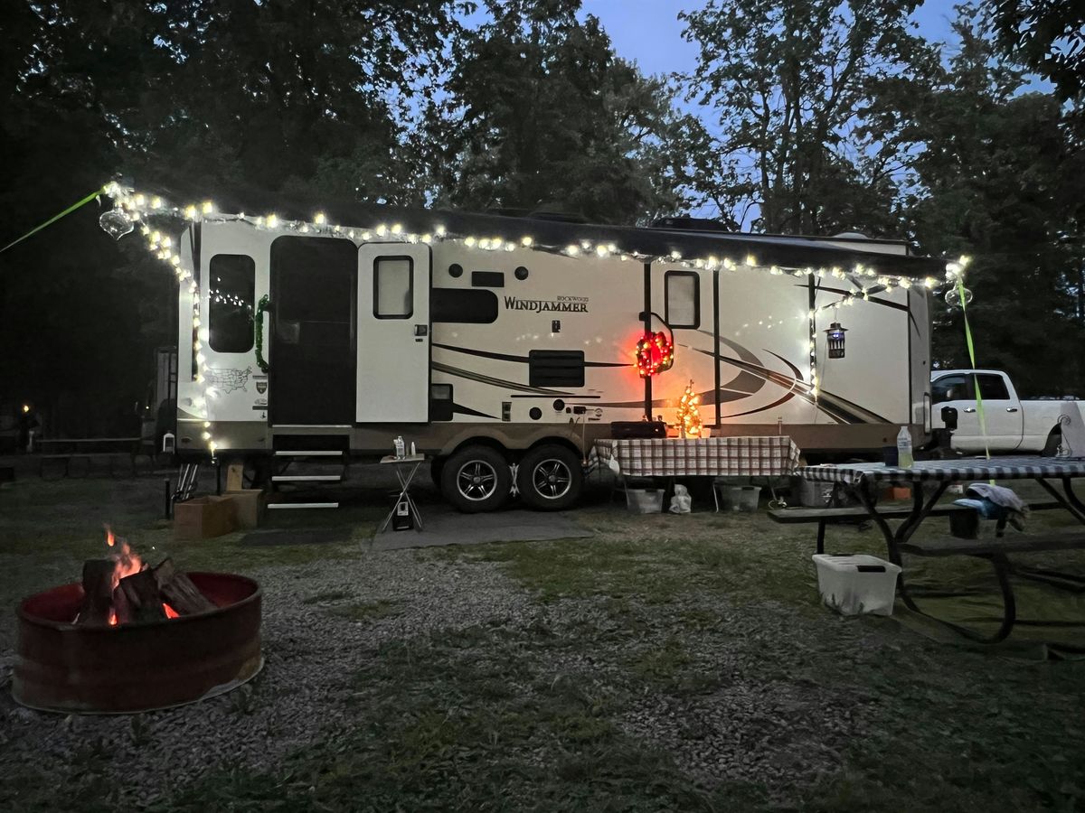RV plugged into a campground power pedestal